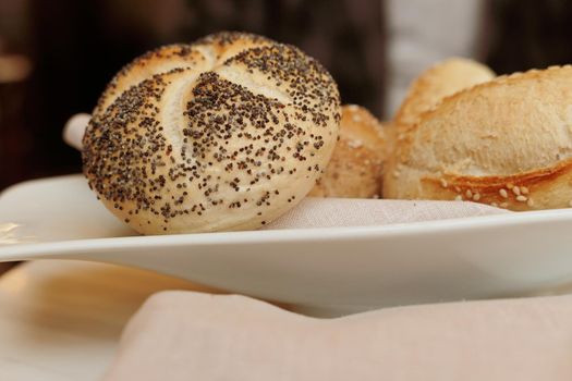 Gluten free pastry, eating out and healthy lifestyle concept - Fresh white bread in a restaurant