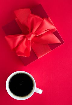 Romantic celebration, lifestyle and birthday present concept - Luxury beauty gift box and coffee on red, flatlay