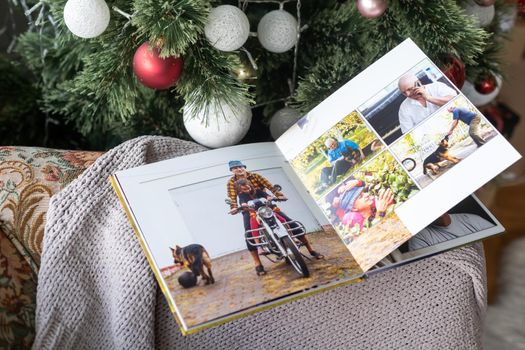 travel photo book near the Christmas tree