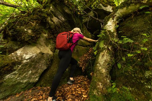 Fit woman walking on the mountain. Healthy lifestyle concept.