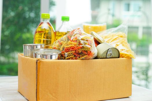 Foodstuffs in donation box for volunteer.