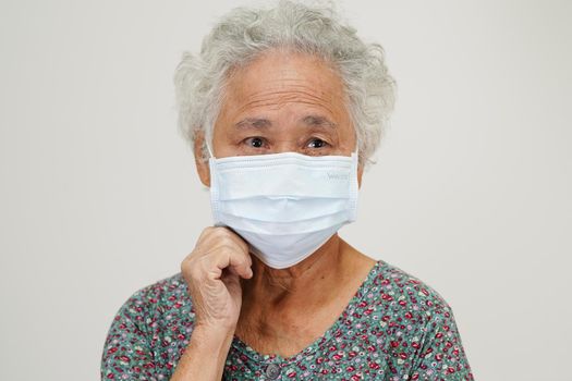 Asian elder senior woman patient sitting and smile face with happy on bed in hospital.