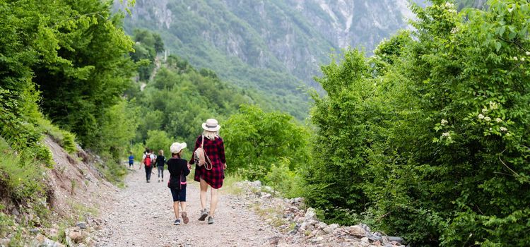 tourists in the mountains of albania, theth.