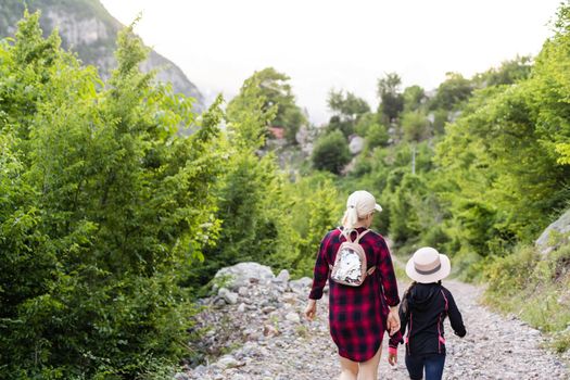Traveling mother and daughter in the mountains of albania.