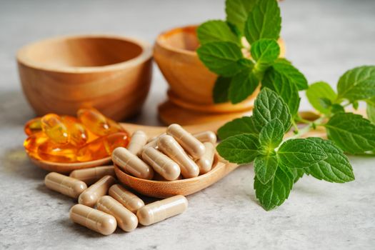 Alternative medicine herbal organic capsule with vitamin E omega 3 fish oil, mineral, drug with herbs leaf natural supplements for healthy good life.