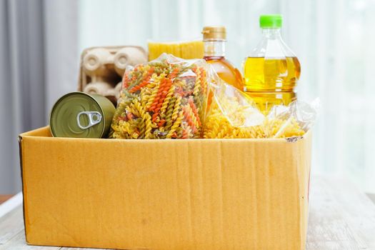 Foodstuffs in donation box for volunteer.