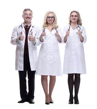in full growth. medical colleagues giving a thumbs up. isolated on a white background