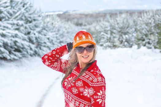 Happy woman enjoying the snow covered landscape in Australia during winter