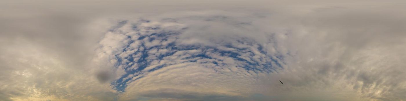 Sky panorama on overcast rainy day with low clouds in seamless spherical equirectangular format. Complete zenith for use in 3D graphics, game and for aerial drone 360 degree panorama as a sky dome.