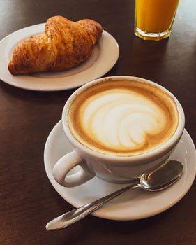 Breakfast, food and drinks and service concept - Cappuccino in a restaurant, at a coffee break