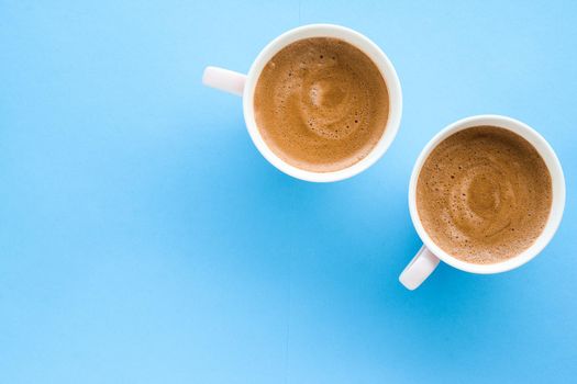 Breakfast, drinks and modern lifestyle concept - Hot aromatic coffee on blue background, flatlay