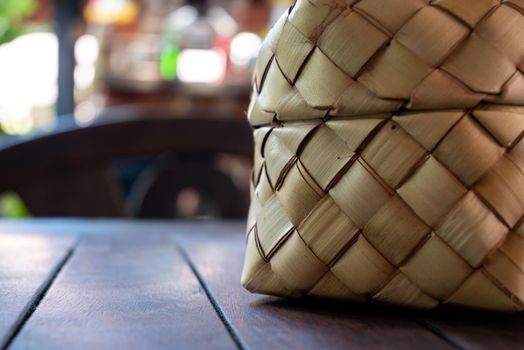 Bamboo wicker sticky rice basket called "Kratip" in the northeastern province, Thailand. Asian sticky rice container. Traditional sticky rice baskets are used in local houses and restaurants.