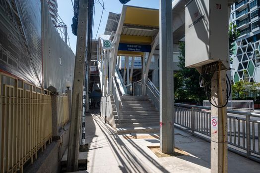 Bangkok, Thailand - August 24, 2022: Atmosphere morning on the walkway near "Khlong San" BTS station, Construction site on the left-hand side. A lot of poles on the walkway.