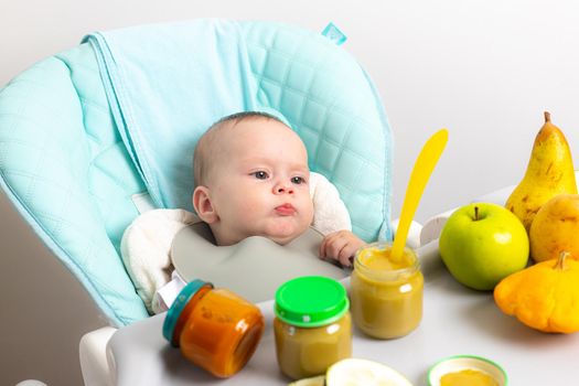 Puree for baby food with vegetables and fruits. Selective focus. nutrition. The first complementary feeding of the child. A happy child. A well- fed child