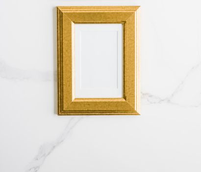 Golden photo frame on marble, flatlay - modern feminine, artwork mock up, luxury design concept. Decorate with chic and style