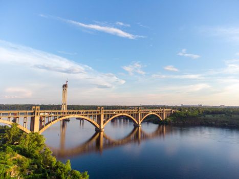 Preobrazhensky Bridge and Dnieper River in structure of suspension architecture concept, Urban city, Zaporozhye. Zaporizhzhia Arch Bridge download photo