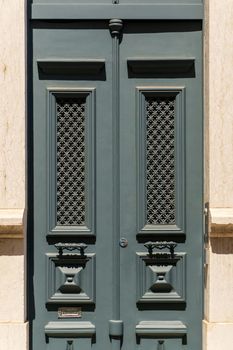 Beautiful gray vintage closed door to the building background