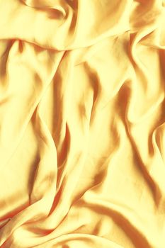 Luxury golden silk background texture - elegant fabric textures, abstract backgrounds and modern pastel colours concept