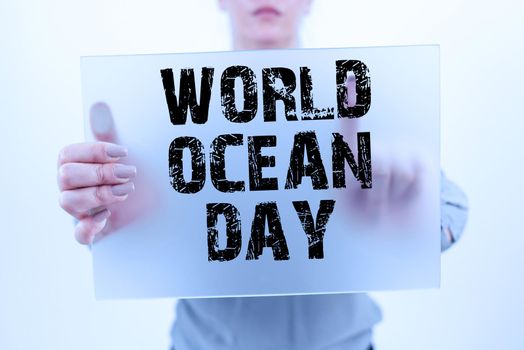 Sign displaying World Ocean Day, Business approach Worldwide celebration for big bodies of salt water Businessman With Two Hands Searching For Important Data And New Ideas.