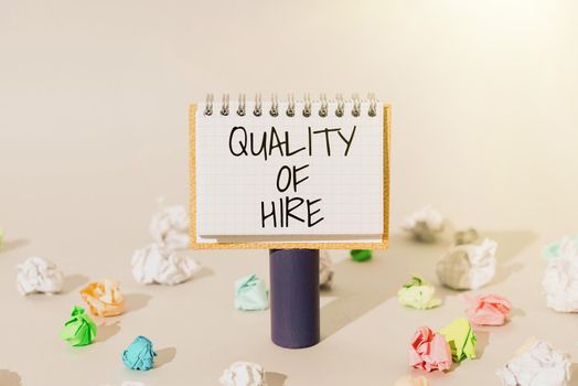 Handwriting text Quality Of Hire, Business overview Good professionals hired for a job Successful recruitment Lady in suit holding pen symbolizing successful teamwork accomplishments.