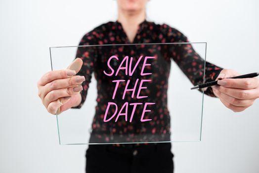 Sign displaying Save The Date, Concept meaning Systematized events Scheduled activity Recorded Filed Important Messages Presented On Mobile Phone On Desk With Paperwraps.