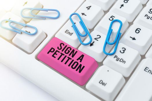 Text sign showing Sign A Petition, Business overview Support a cause by signing paper with an agreement Man Holding Tablet With Graph And Pen Which Points On Arrow Up.