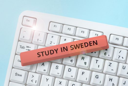 Text sign showing Study In Sweden, Business concept Travel to European country for educational purposes Businessman Holding Tablet And Presenting With Other Hand Important Message