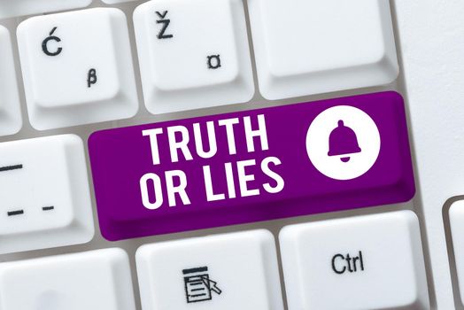 Writing displaying text Truth Or Lies, Business concept Decide between a fact or telling a lie Doubt confusion Woman With Lap Top On Desk Pointing Important Messages With One Finger.