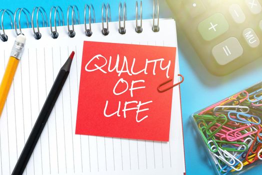 Sign displaying Quality Of Life, Word Written on Being in good health decent job Enjoying every moment Businessman Pointing Important Informations With Pen In Hand.