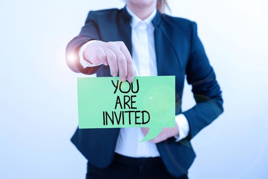 Inspiration showing sign You Are Invited, Concept meaning Receiving and invitation for an event Join us to celebrate Speech Bubble With Important Messages Next To Magnifier On Floor.