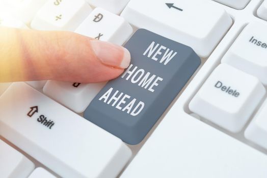 Inspiration showing sign New Home Ahead, Business approach Buying an own house apartment Real estate business Relocation Woman Typing Updates On Lap Top And Pointing New Ideas With One Finger.