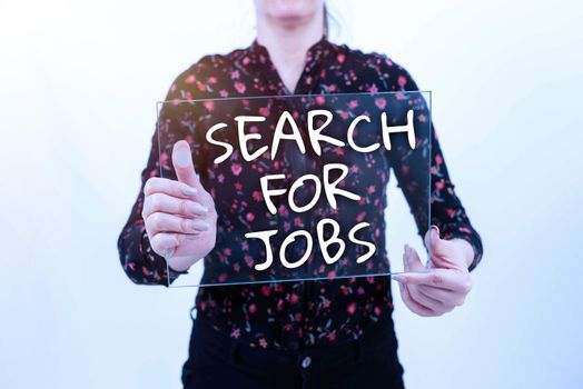 Hand writing sign Search For Jobs, Word for Unemployed looking for new opportunities Headhunting Man With Laptop And Tablet Pointing On S Searching For Data And Ideas.