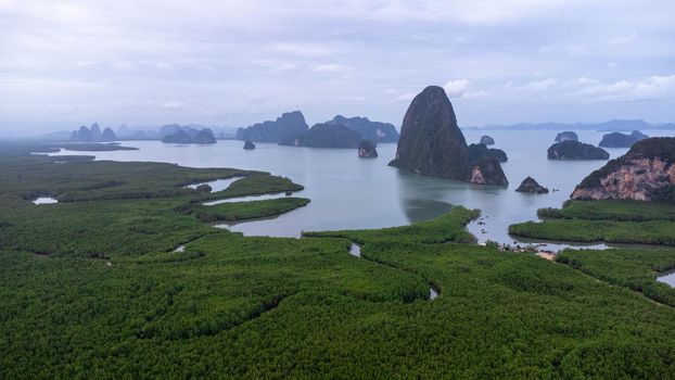 Aerial view of Samet Nangshe and mangrove forest at sunset in Phang Nga Bay in the Andaman Sea, Thailand. Travel and holidays vacation concept. Beautiful natural landscape background