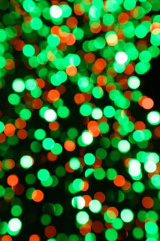 Blurry multicolored garland with glowing lights.