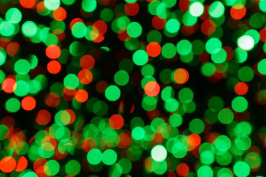 Blurred background, bokeh with colorful lights, holiday lighting.