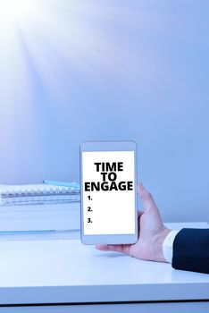 Sign displaying Time To Engage, Business concept Right moment for get a compromise engagement with someone Woman With Cellphone Displaying Digital Global Communication Development.