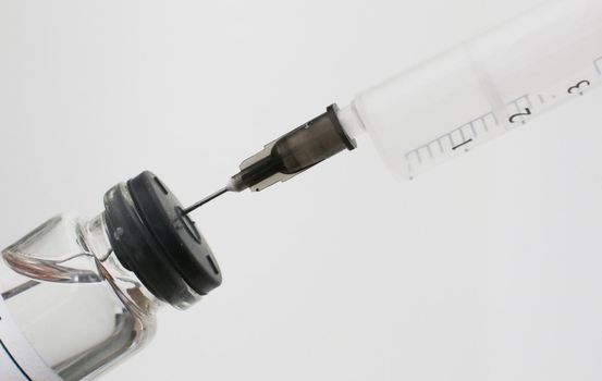 Bottle and Syringe. Coronavirus Vaccine. Medical concept.