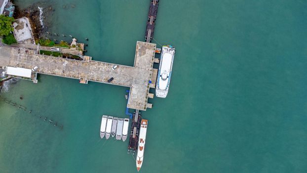 Aerial view from drone of Yacht and cruise ship parked in the marina. Transportation and travel background, beautiful sea in summer.