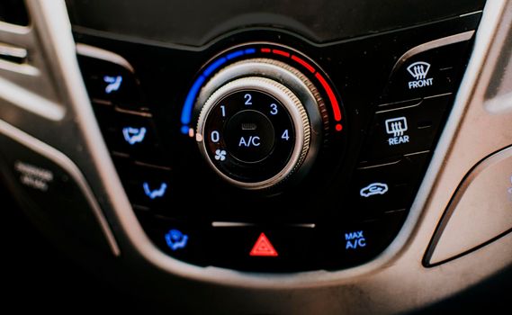 Front view of a car air conditioning control panel. Air conditioning knob of a car. Close up of automotive air conditioning switch panel