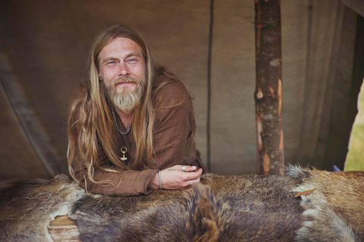 Hojbjerg, Denmark, August, 2022: Viking sells furs in a tent at the Viking Festival in Denmark