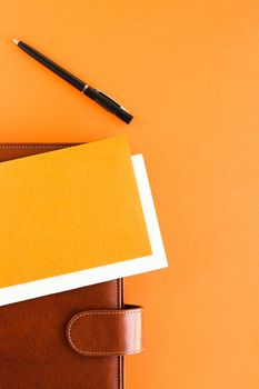 Modern workspace, productivity and corporate lifestyle concept - Luxury business brown brief-case on the office table desk, flatlay