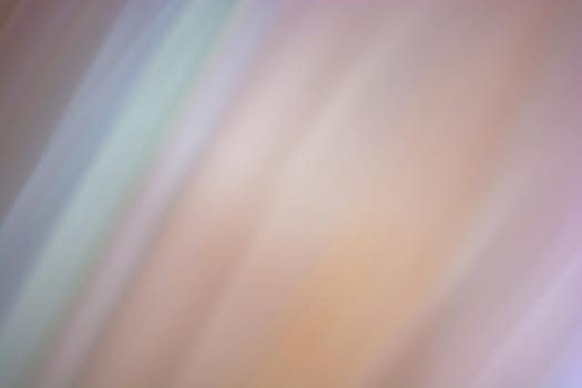 Abstract multicolored background with softly blurred diagonal lines in beige shades. Banner. Backdrop