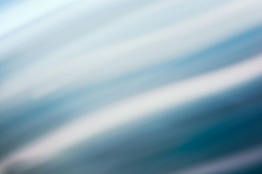 Abstract wavy background in blue tones with a gradient. Backdrop
