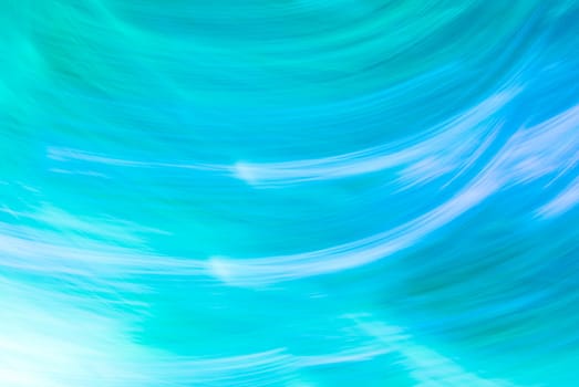 Abstract turquoise blue background with wavy highlights, curved lines and a gradient. Backdrop