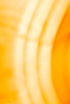 Vertical yellow orange background with glowing arcs. Abstraction. Backdrop