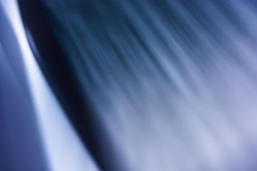 Abstraction. Blue softly blurred curtain. Waves, ripples and bright lights. Backdrop