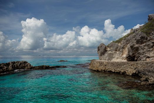 Rocky Caribbean Sea coastline with rocks and azure water on the Isle of Women