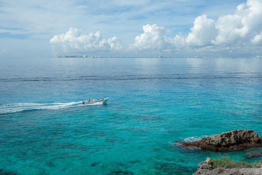 Rocky Caribbean Sea coastline with rocks and azure water on the Isle of Women