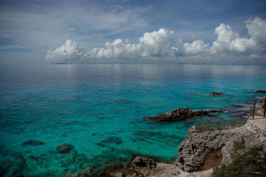 Rocky Caribbean Sea coastline with rocks and azure water on the Isle of Women