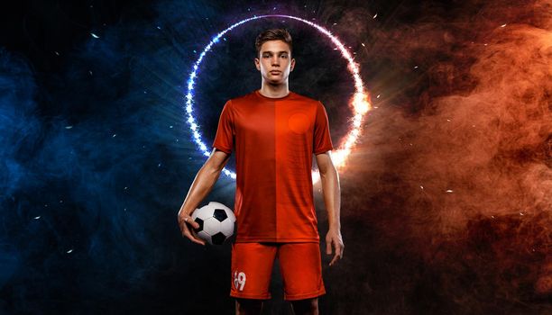 Soccer player. Athlete in football sportswear on game with ball. Sport concept